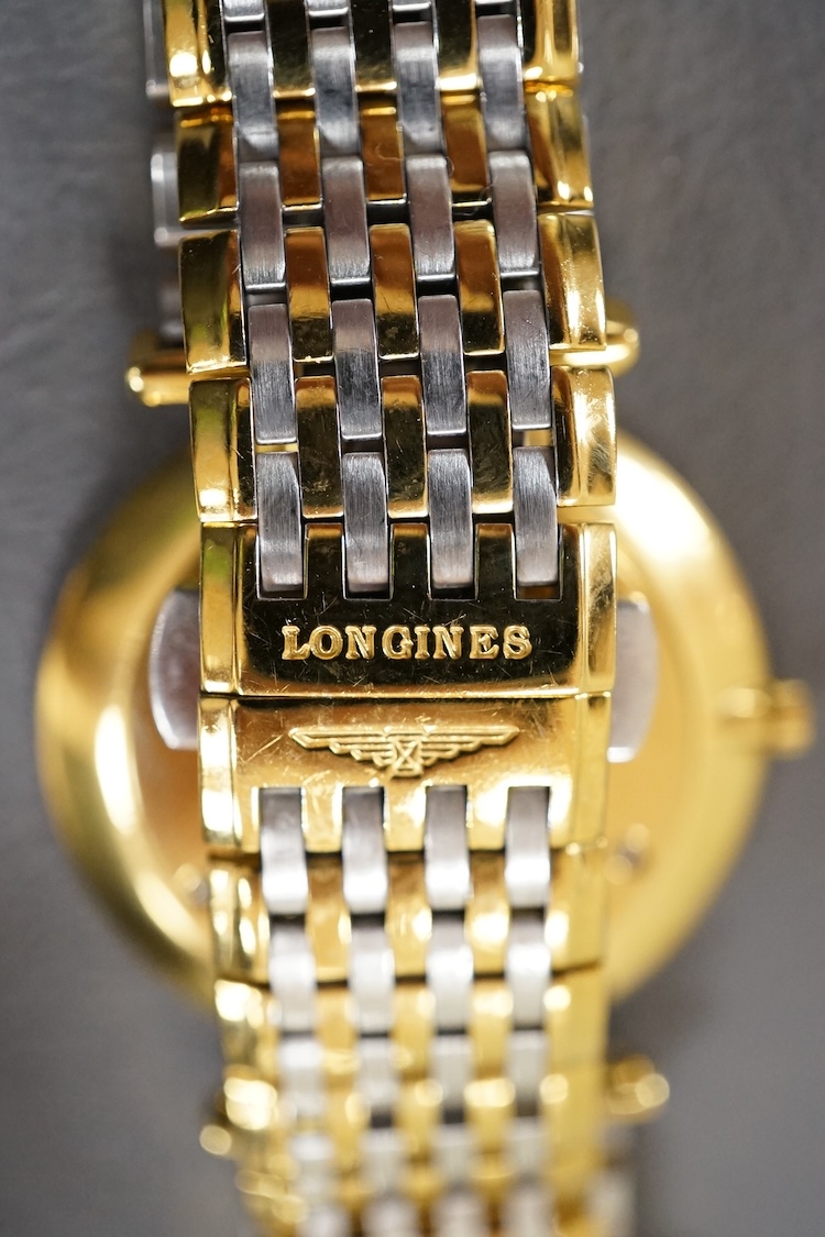 A gentleman's gtwo tone gilt steel Longines L4709-2 Le Grand Classique quartz dress wrist watch, with Roman dial, case diameter 33mm, boxed
